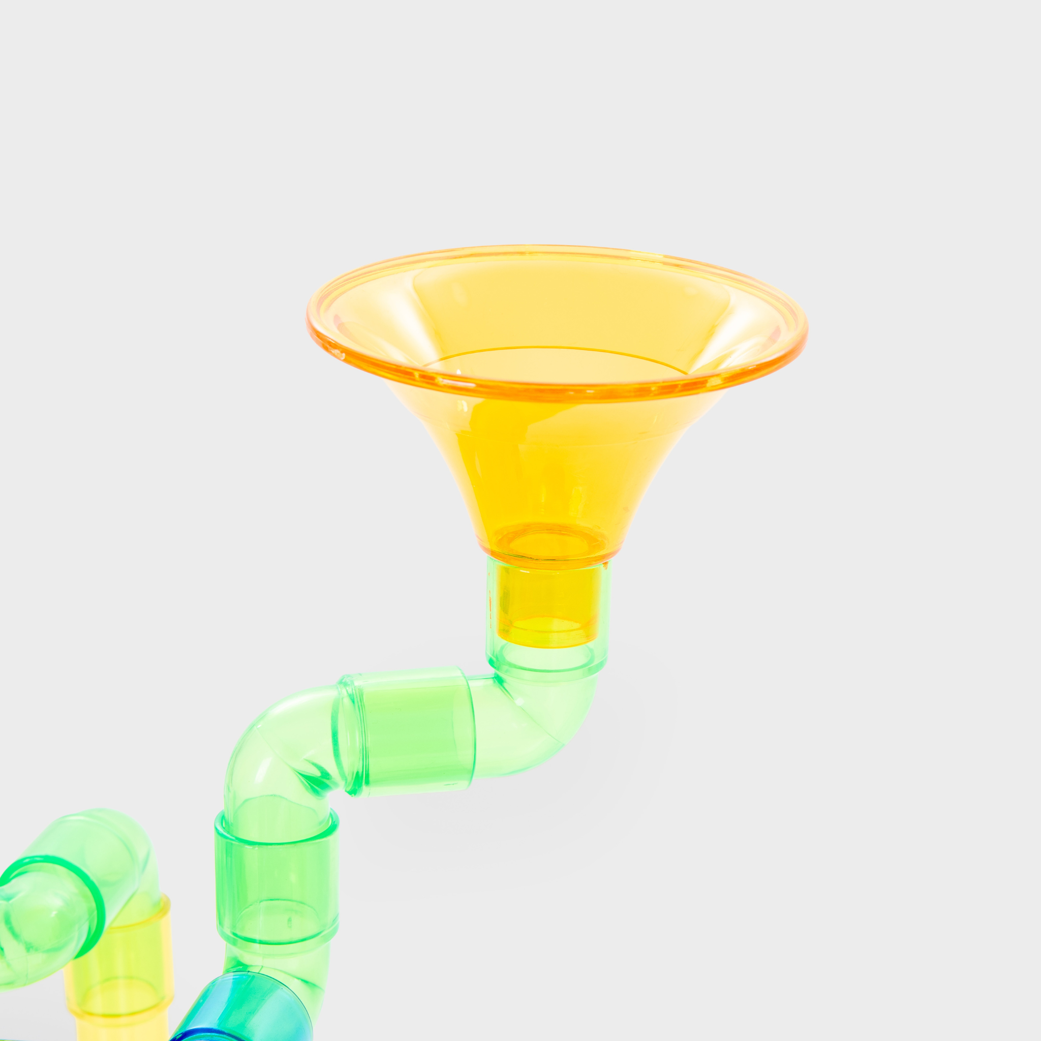 Průhledný trychtýř a barevné trubky stavebnice TickiT Water Pipes